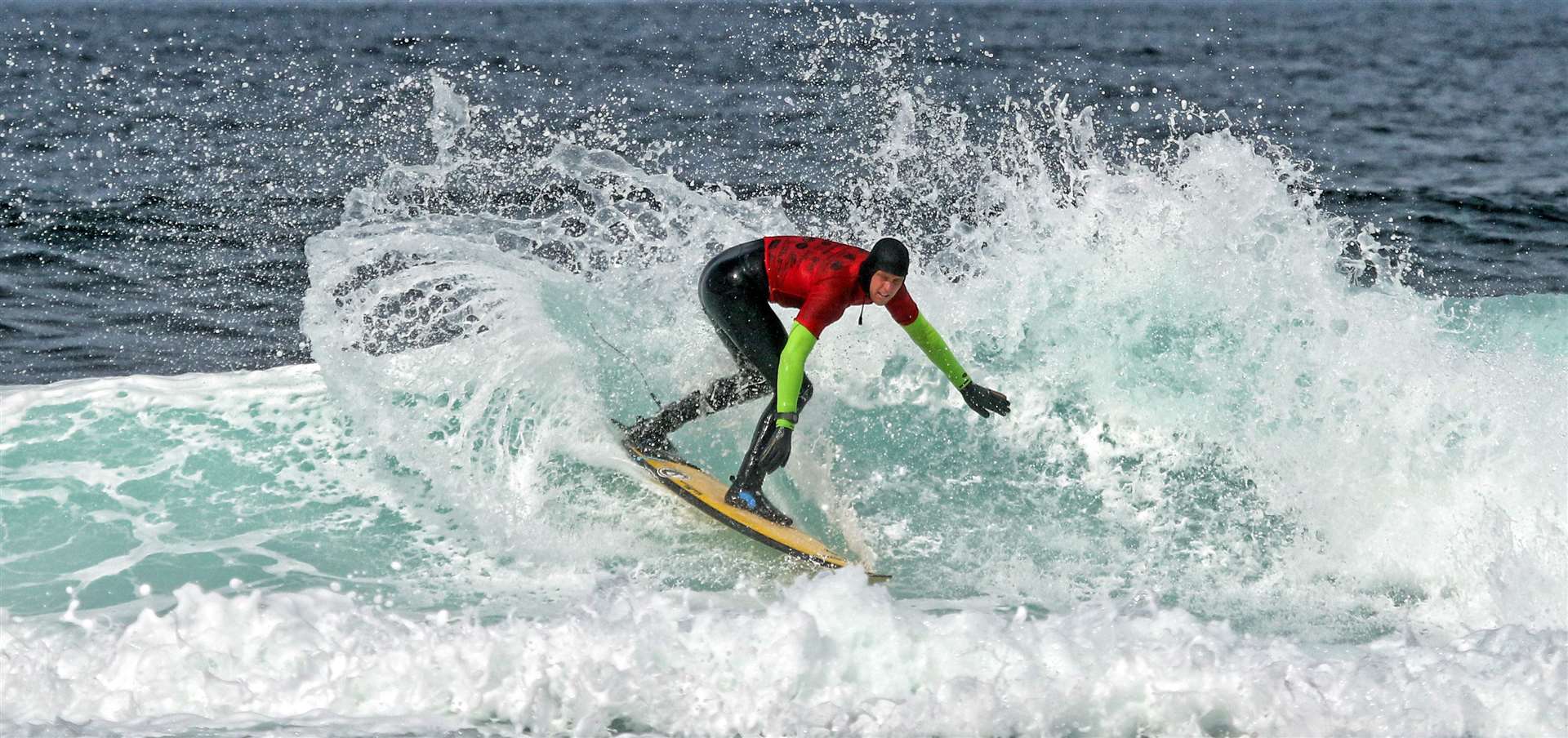 Mark Boyd rides the surf at the Scottish National Surfing Championships at Thurso. Picture: James Gunn