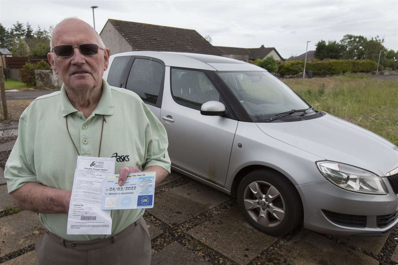 Halkirk man John O'Donnell, Marrbank, Camilla St, Halkirk, with the parking ticket he received for having an expired disability parking card, shortly after his wife died. Photo: Robert MacDonald/Northern Studios