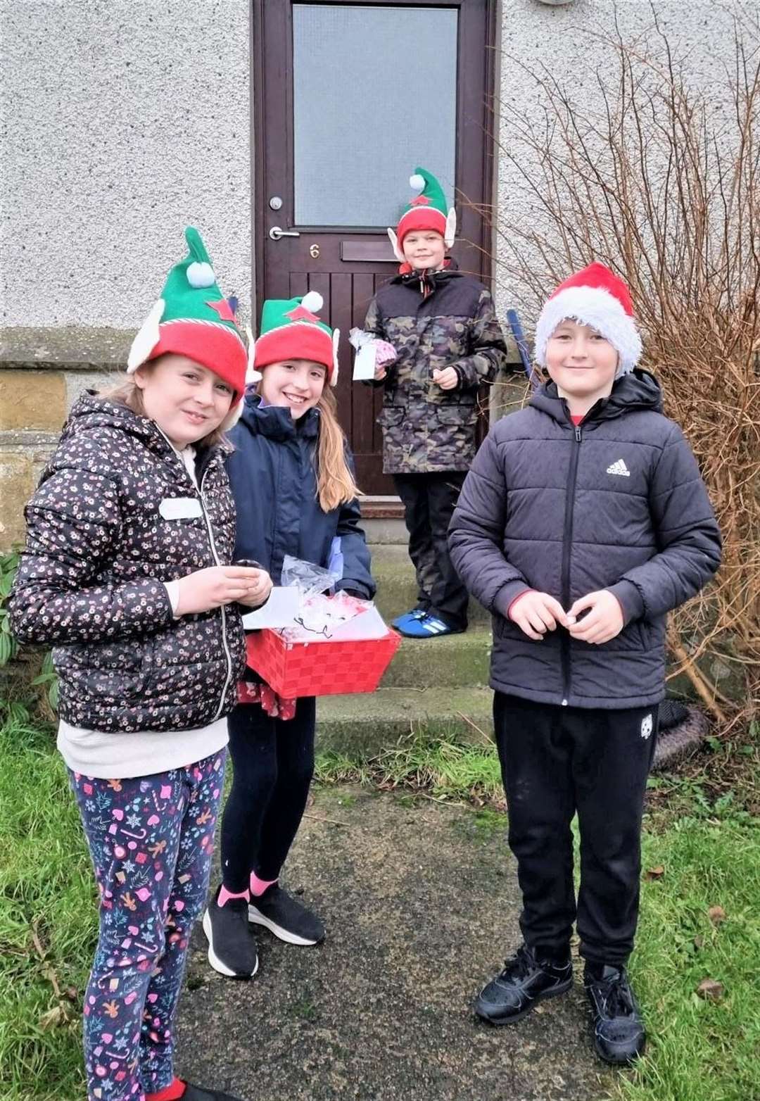 Pupils delivering Christmas tree decorations