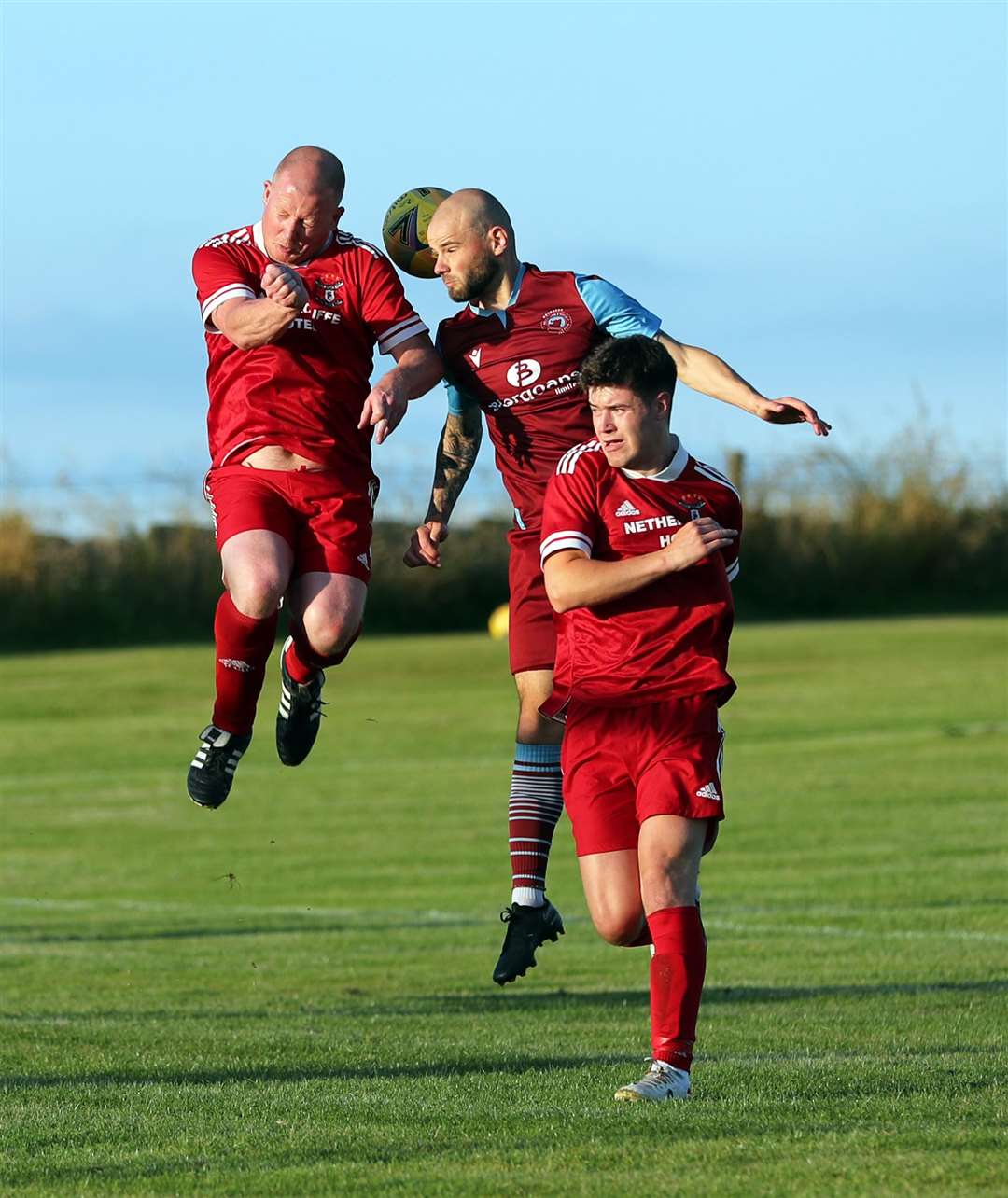 Alan Sinclair in an aerial duel with Pentland United's Sean Munro. Picture: James Gunn