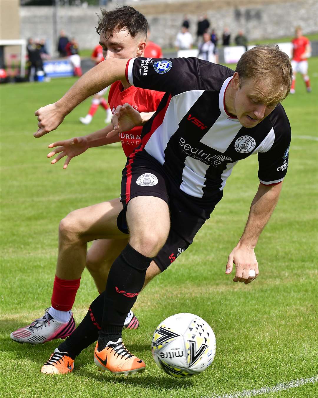 James Mackay of Wick Academy turns Nairn County's Sam Gordon. Picture: Mel Roger
