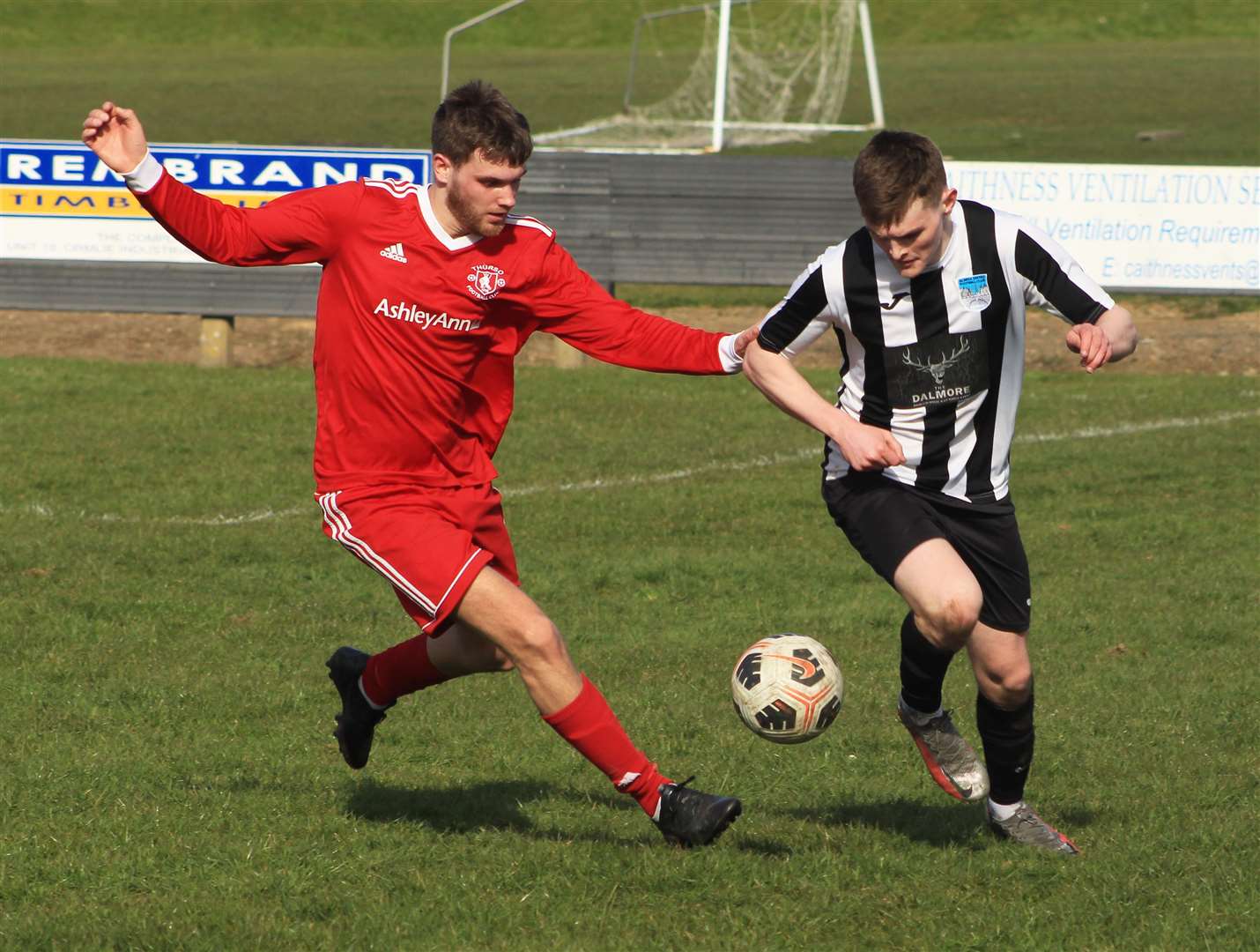 Thurso's Connor Macleod gets to grips with Kyle Taylor of Alness United. Picture: Alan Hendry