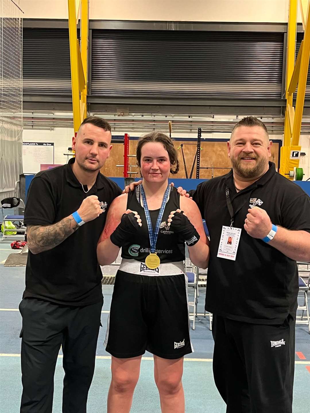 Alisha Mackay with Caithness Boxing Club's founder and head coach Liall Mackenzie (left) and coach Richard Thurling after her success at the Boxing Scotland National Development Championships.