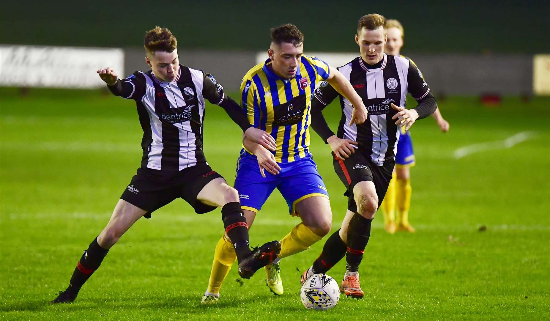 Wick Academy teenager Conor Farquhar challenges Locos' Lloyd Robertson as Steven Anderson looks on. Picture: Mel Roger