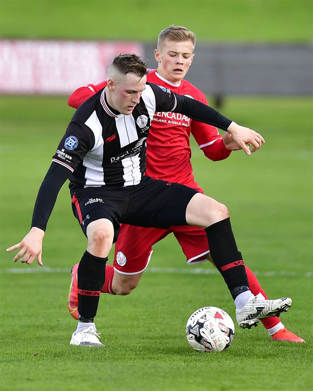 Wick Academy's Steven Anderson holds off a challenge from Brechin City's Max Kucheriavyi. Picture: Mel Roger