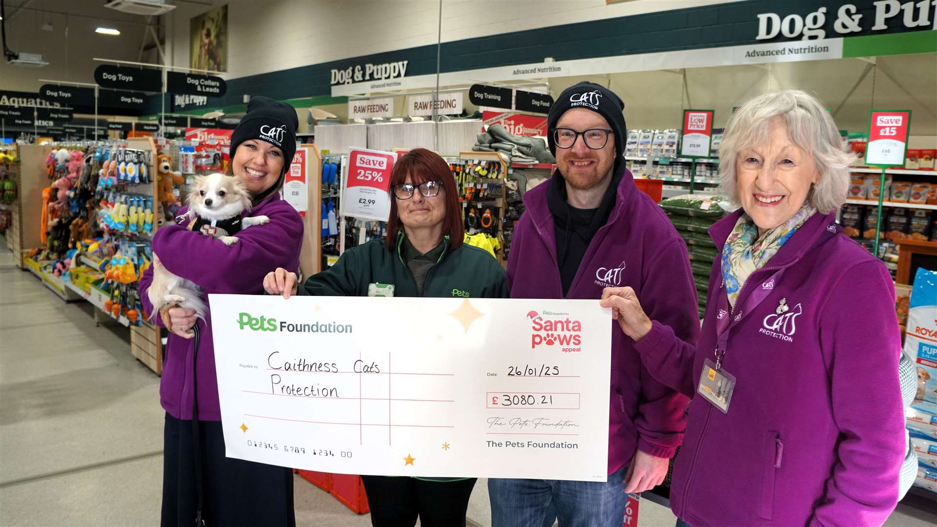 From left, Cats protection volunteer Gail Ross with Bean the chihuahua, Kirsteen MacKenzie from Pets at Home, Andy Milne from the cat charity group and Joan Campbell who heads up the local Cats Protection fundraising team. Since no cats were present Bean was an 'honorary cat for the day'. Picture: DGS