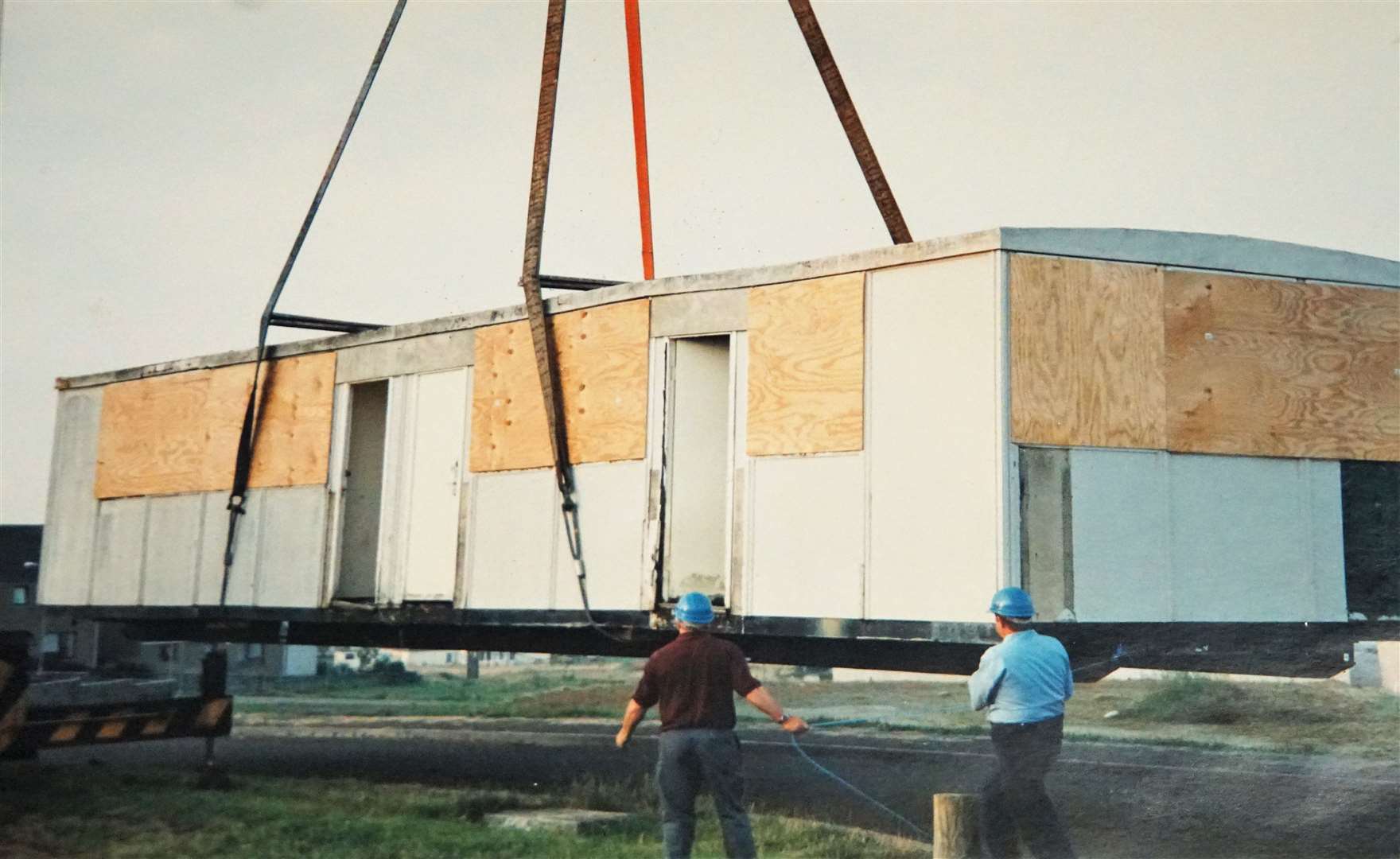 This archive picture from 1997 shows a portable building donated by Dounreay being lowered down on Neil Gunn Drive to give the radio station its 'temporary' base.