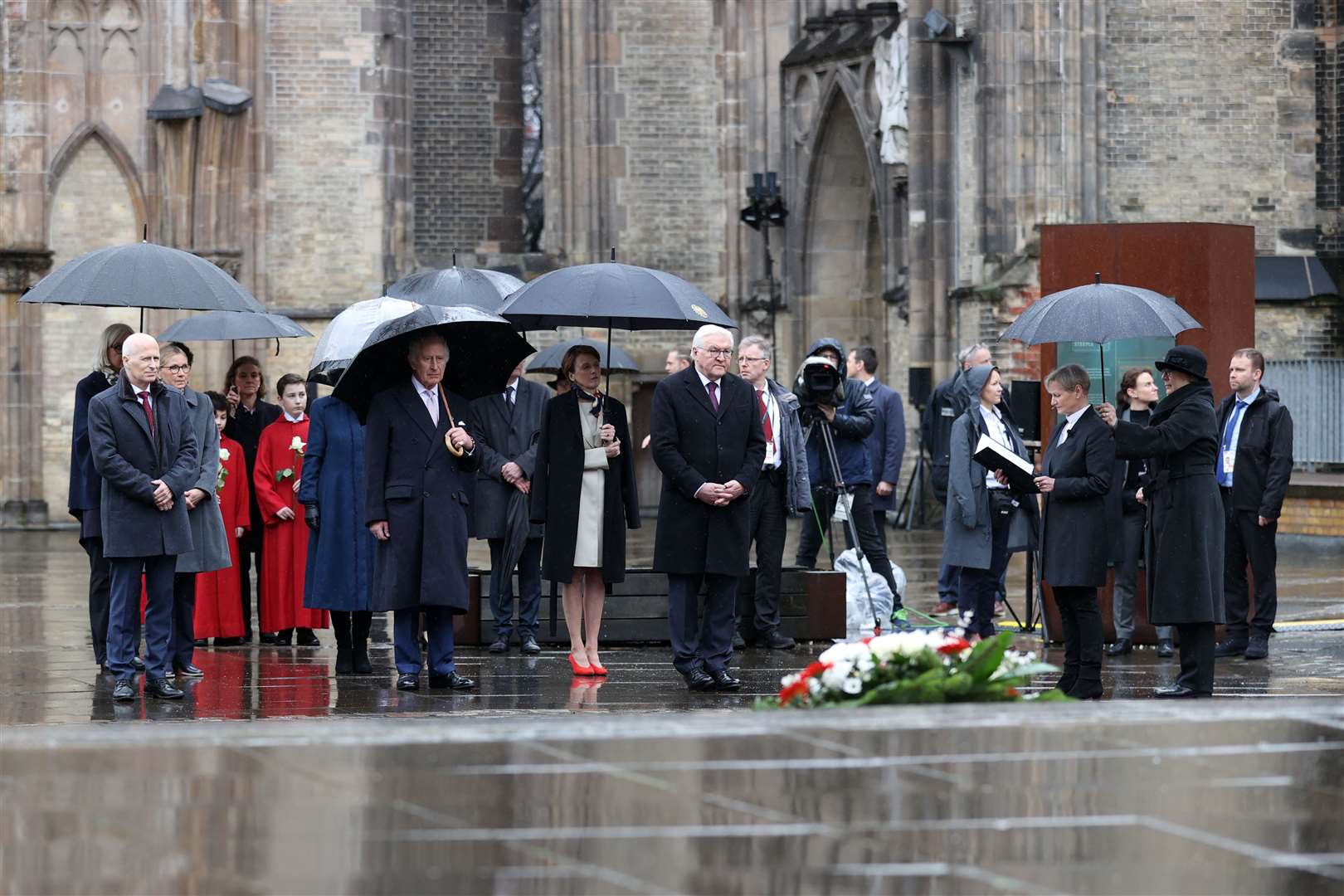 Left to right, Hamburg’s mayor Peter Tschentscher, the King, Elke Buedenbender, and German President Frank-Walter Steinmeier during a wreath-laying ceremony, symbolising reconciliation and the German-British friendship, at St Nikolai Memorial Church, Hamburg (Adrian Dennis/PA)