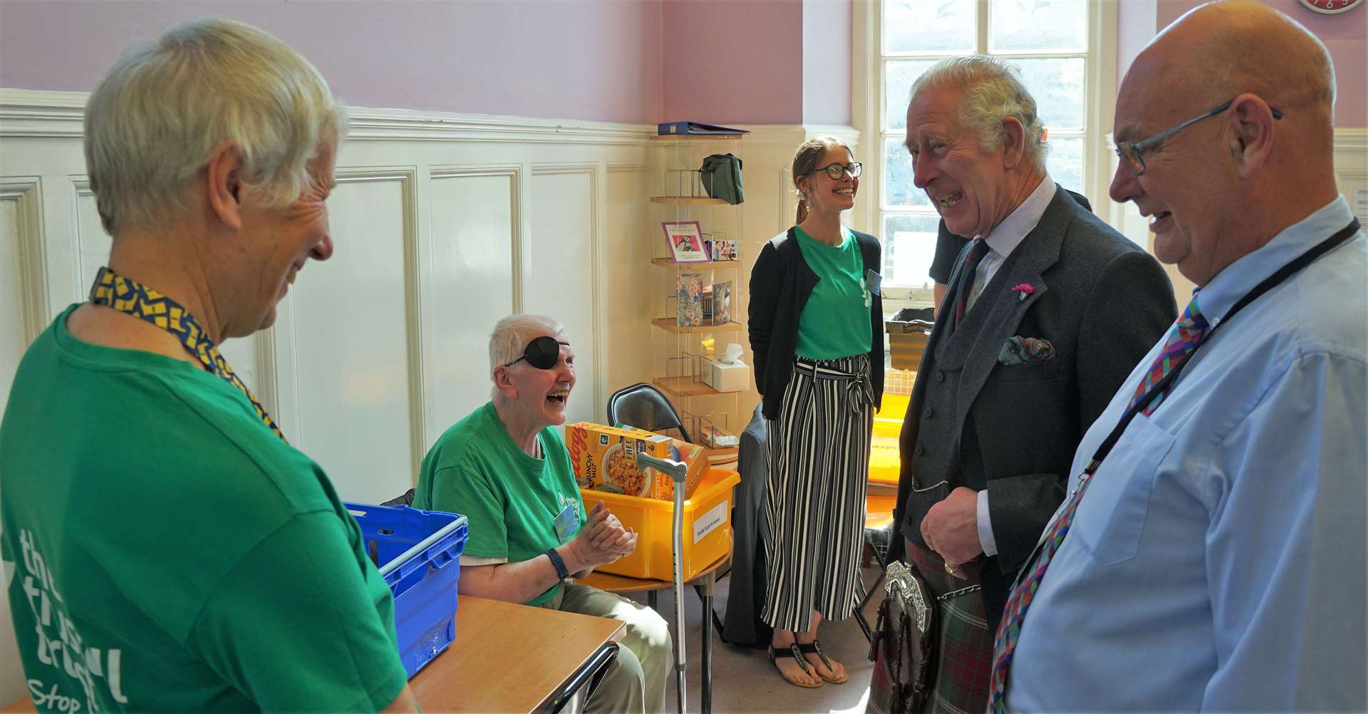 Garry Robertson, a volunteer at the food bank, guffaws as Prince Charles makes a light-hearted comment. Picture: DGS