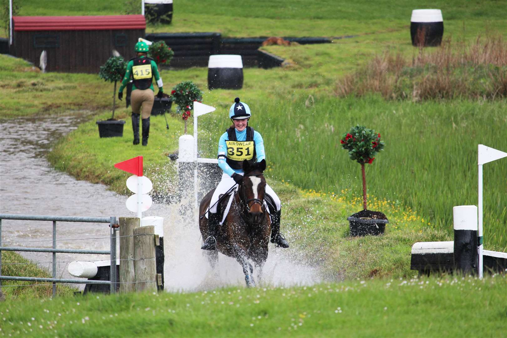 Emma Mackay and Laucors Boadicea coming through the water splash at Scotsburn heading for the last jump on the BE80(T) cross-country course.