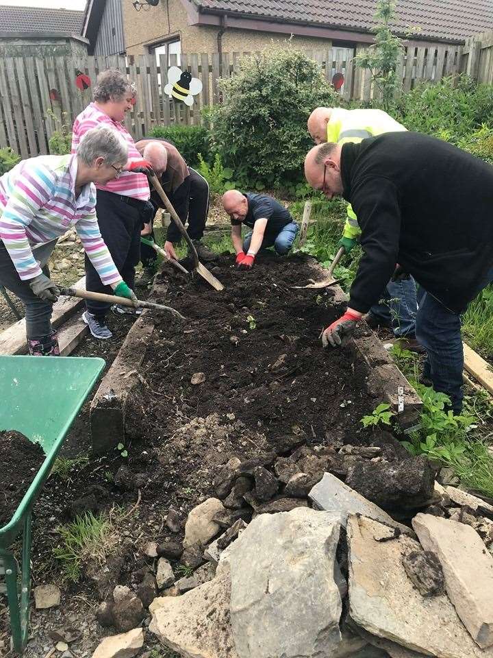 Volunteers and staff digging in at the Thurso Grows project.