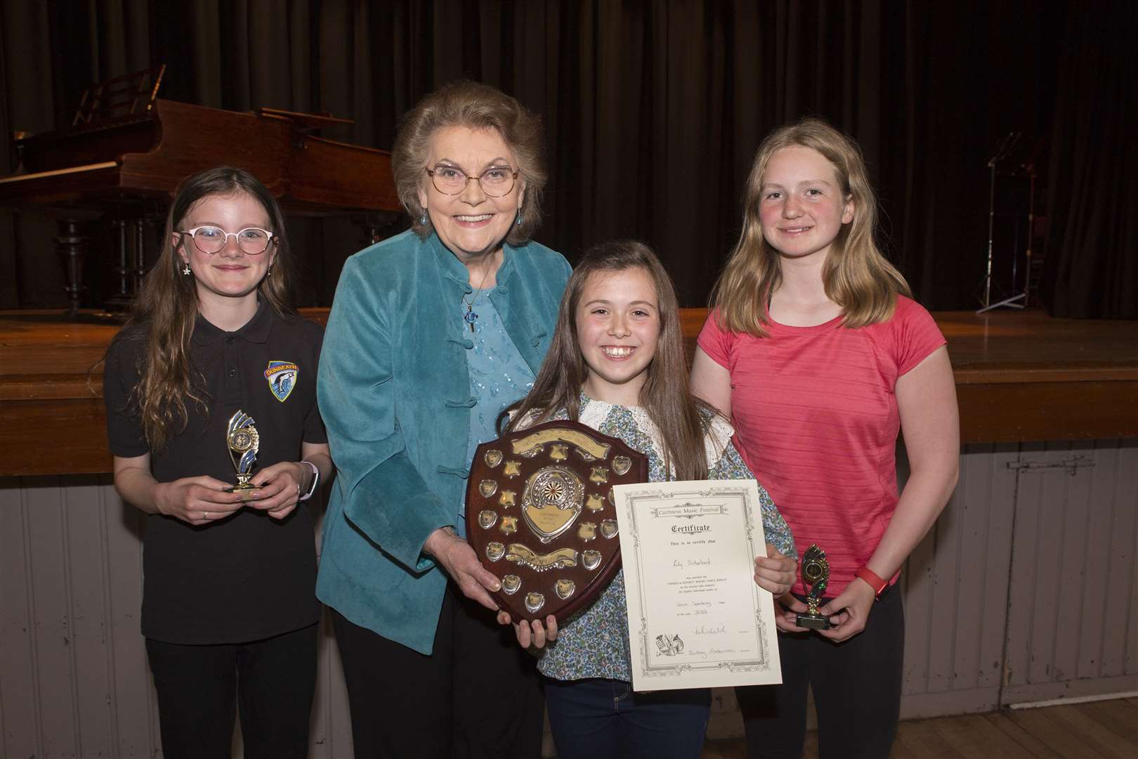 Lily Sutherland, of Wick, won the Thurso and District Round Table Shield, the overall trophy for verse-speaking. She received the trophy from adjudicator Norma Redfearn, alongside other finalists Skye Bain (left), Dunbeath, and Kirsty May, Thurso High School. Picture: Robert MacDonald / Northern Studios