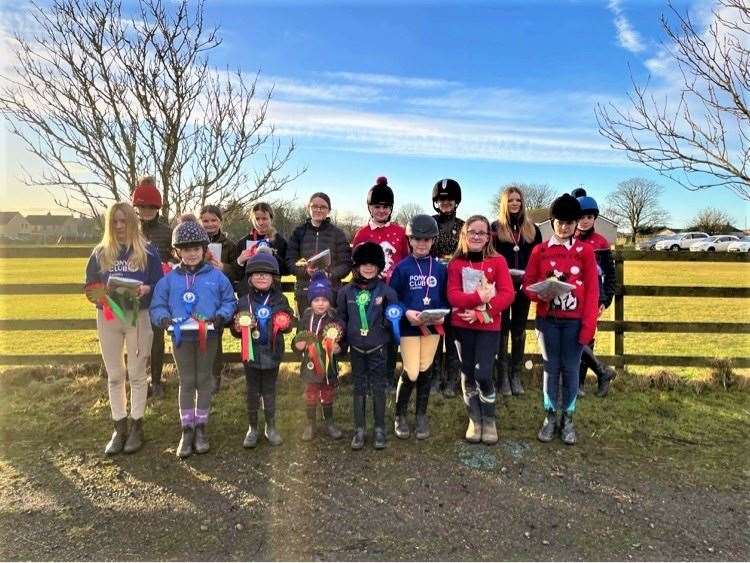 All the riders with their rosettes.