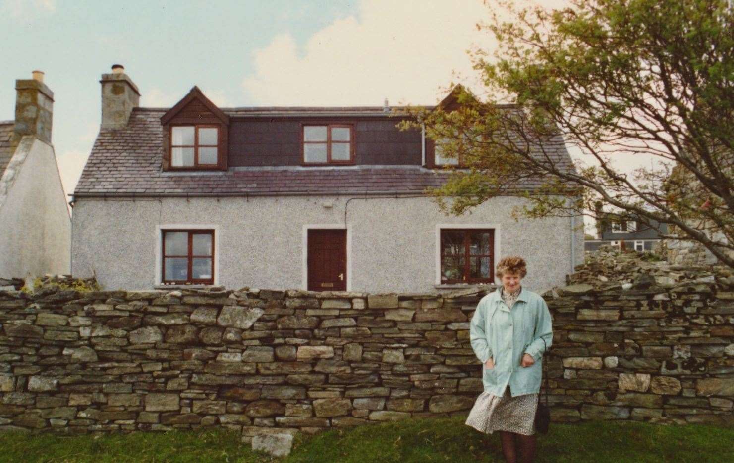 Wilma in 1990 outside the house where she was born.