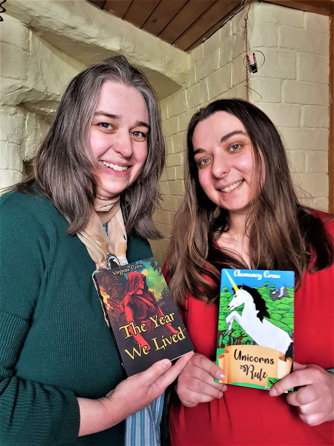 Virginia, left, with Clemency showing their new books.