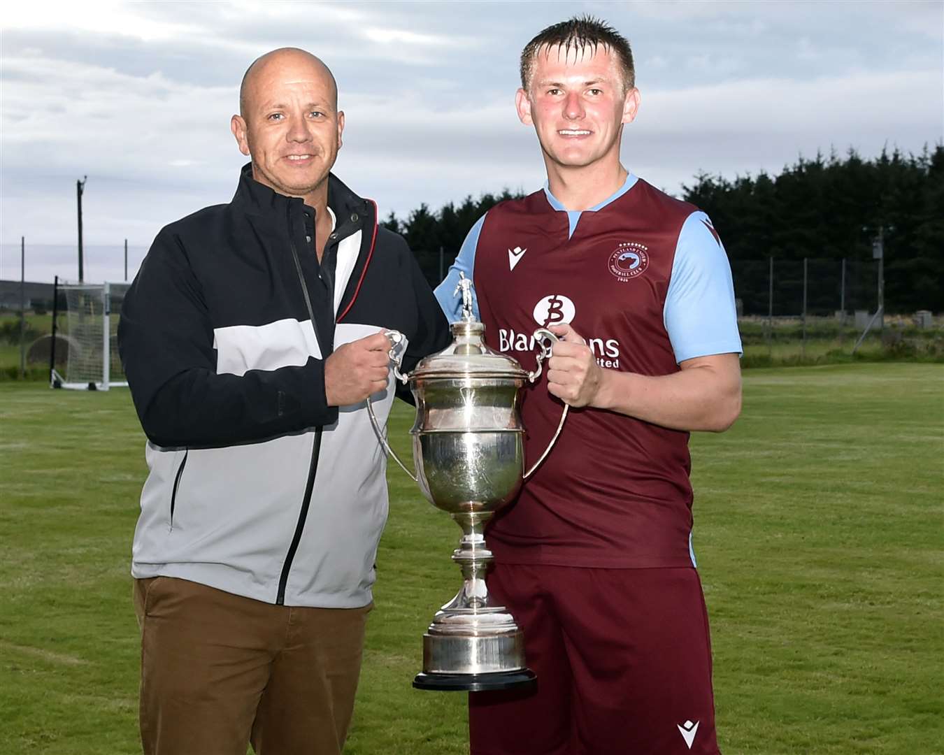 Pentland United captain Andy Mackay receiving the league trophy from CAFA secretary Andrew Lannon. Picture: Mel Roger