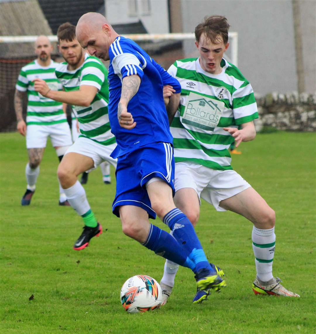 Adam Sherry (Keiss) holds off a challenge from Castletown's Jake Dunnet. Pictures: Alan Hendry