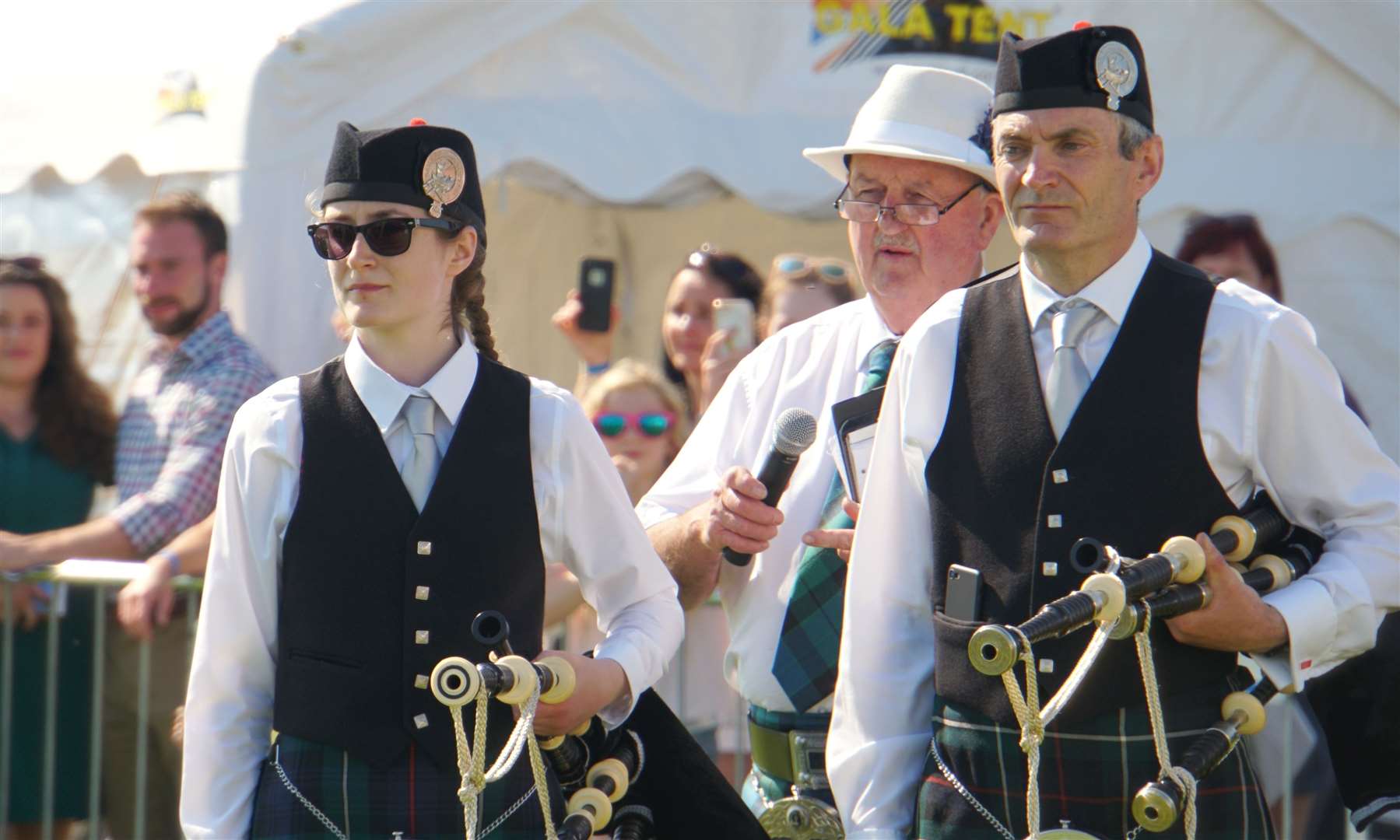 Willie as MC at the Mey Games in 2019, along with members of Wick RBLS Pipe Band. Picture: DGS
