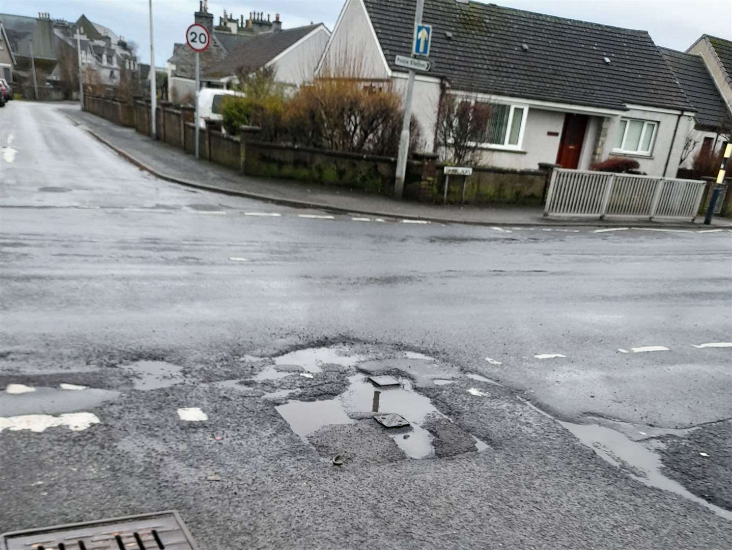 An uneven junction in West Banks Avenue, photographed on Saturday as Wick community councillors counted and measured potholes. Picture: RBWCC