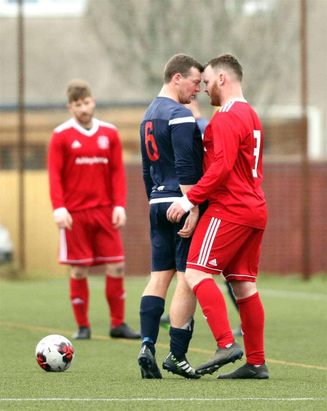Thurso's James Murray (right) has a 'friendly chat' with Jack Maclean of Inverness Athletic. Murray would have the last laugh as his side emerged with a 4-2 victory. Picture: James Gunn