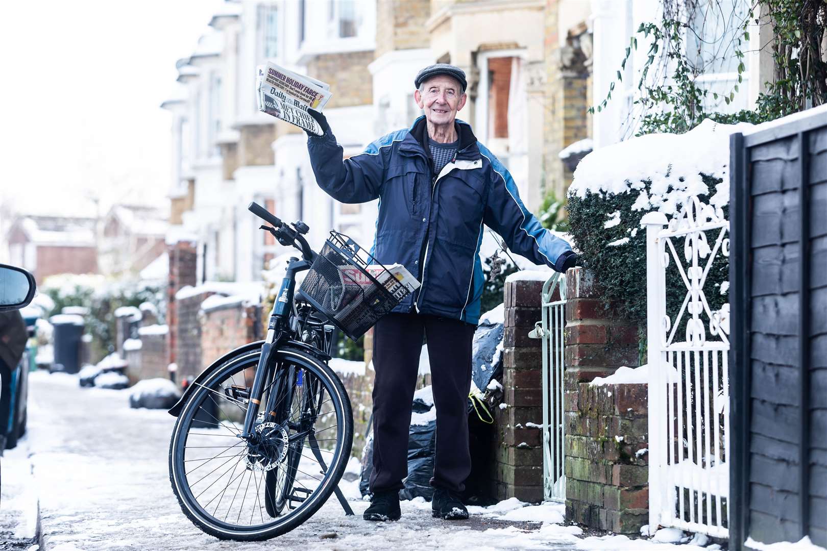 George Bailey, who is one of the oldest paperboys in the UK, completes his paper round in Maidstone, Kent, on his new Raleigh e-bike, which has been given to him by Evans Cycles to celebrate his 80th birthday (Raleigh/Evans Cycles/PA)