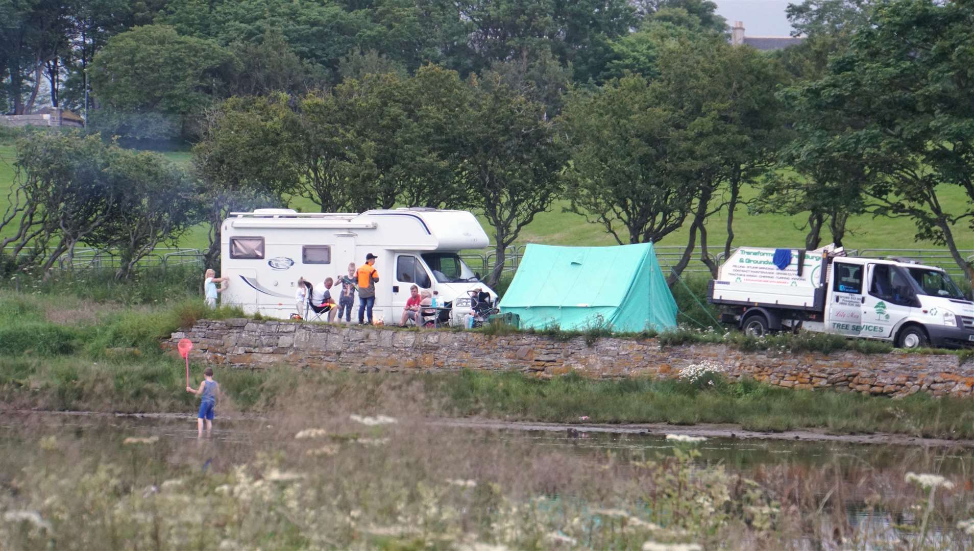 A family of travellers set up camp by Wick River on Tuesday.