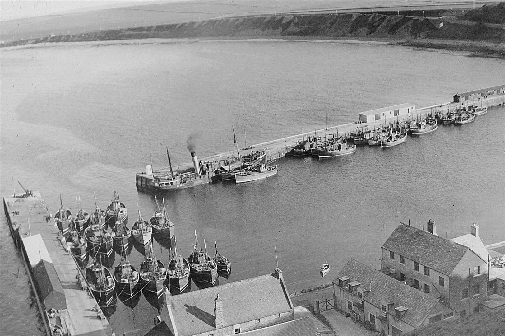 Fishing boats side by side in Scrabster harbour in the early 1950s, viewed from Holborn Head, before construction of the middle pier (photographer not known).