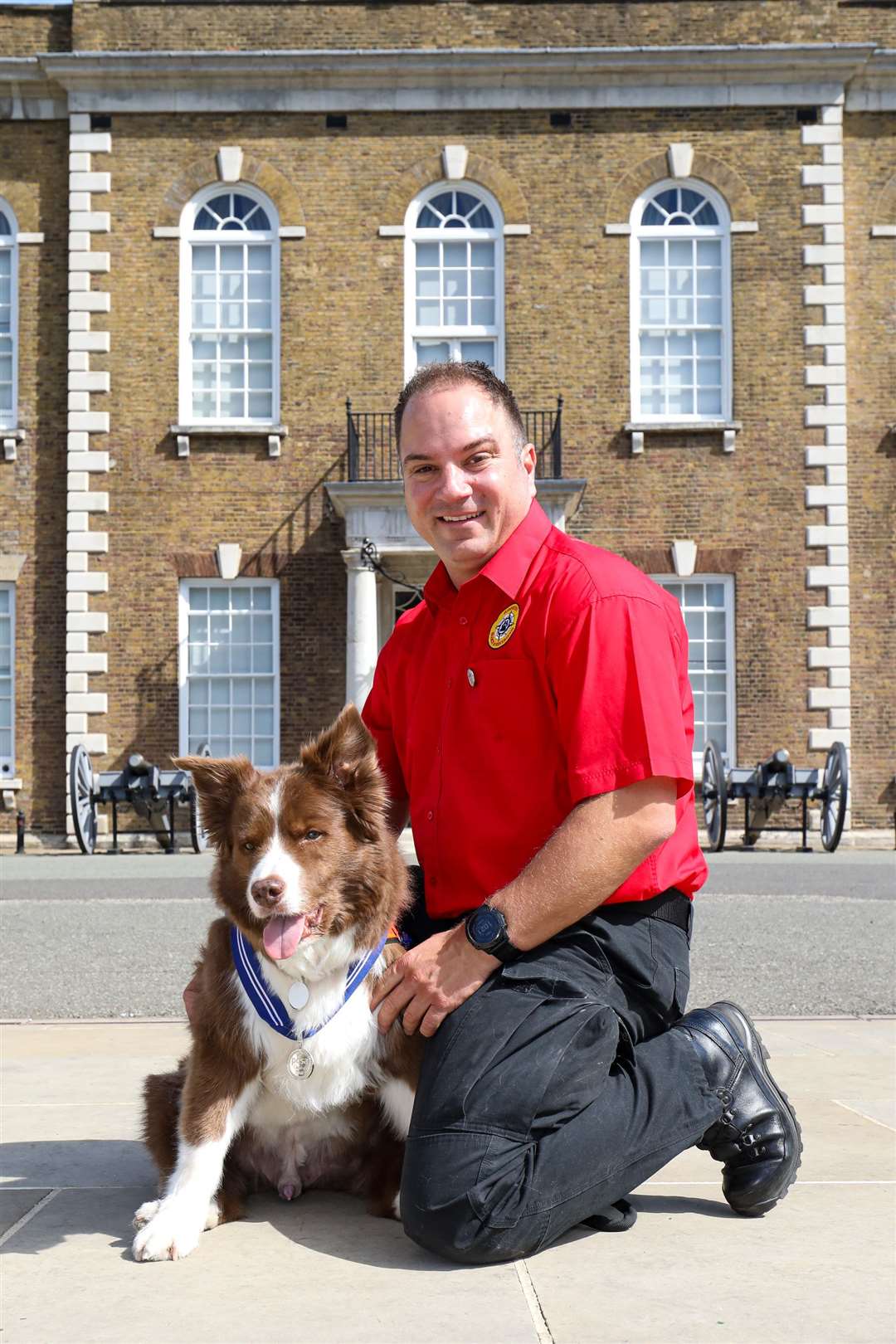 Kevin Saunders and Zak pose for a picture at the ceremony in east London (PDSA/PA)