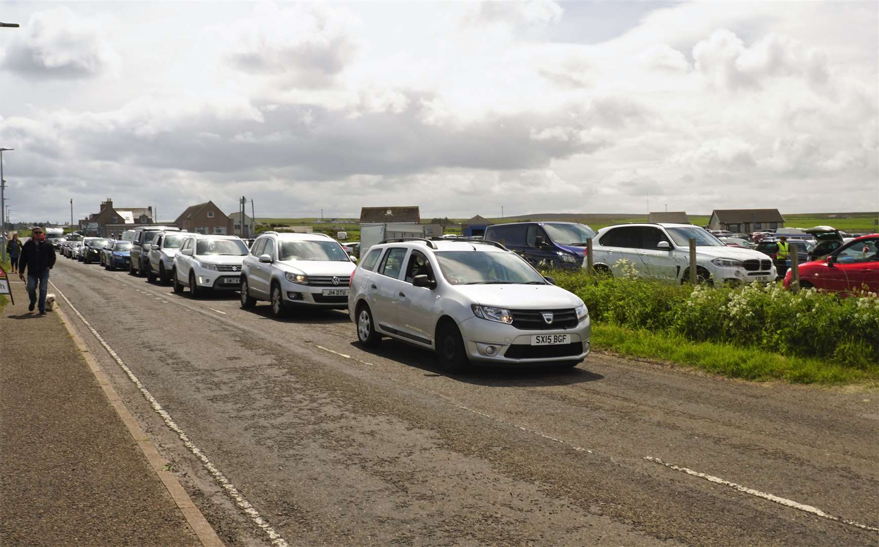 Queue of cars waiting to enter the field. Picture: DGS
