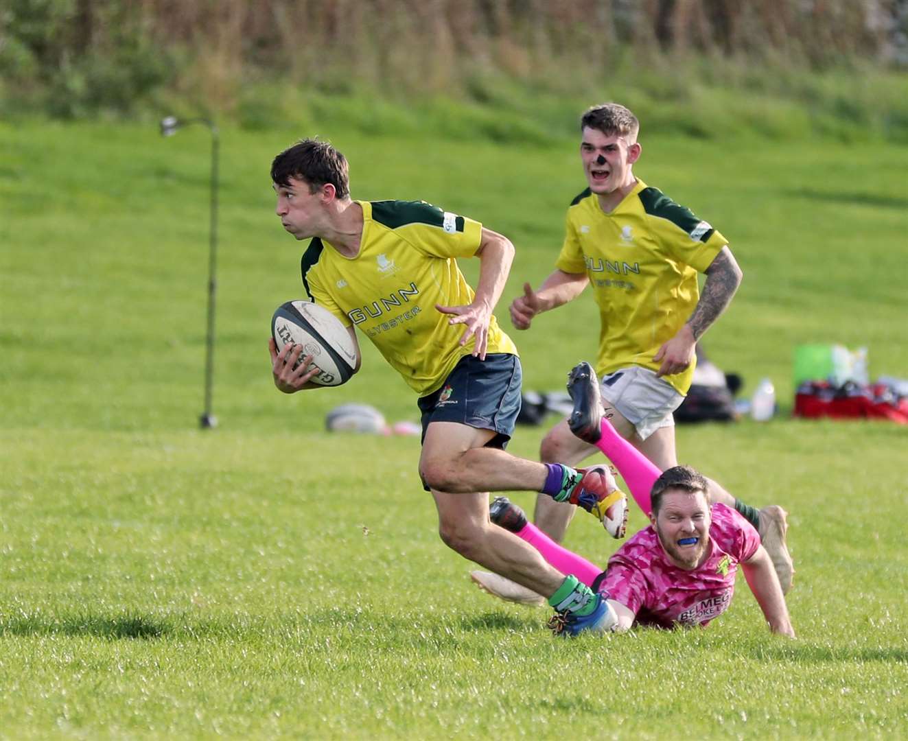 Ben Alba slips through a tackle to head for the try line, with Jack Macleod in support. Picture: James Gunn
