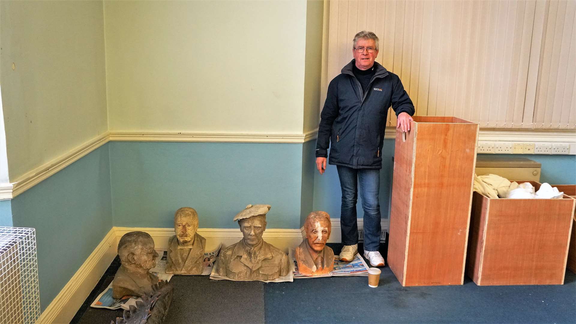 Roy Mackenzie with the various busts recovered from the cellar of the Carnegie building in Wick. Picture: DGS