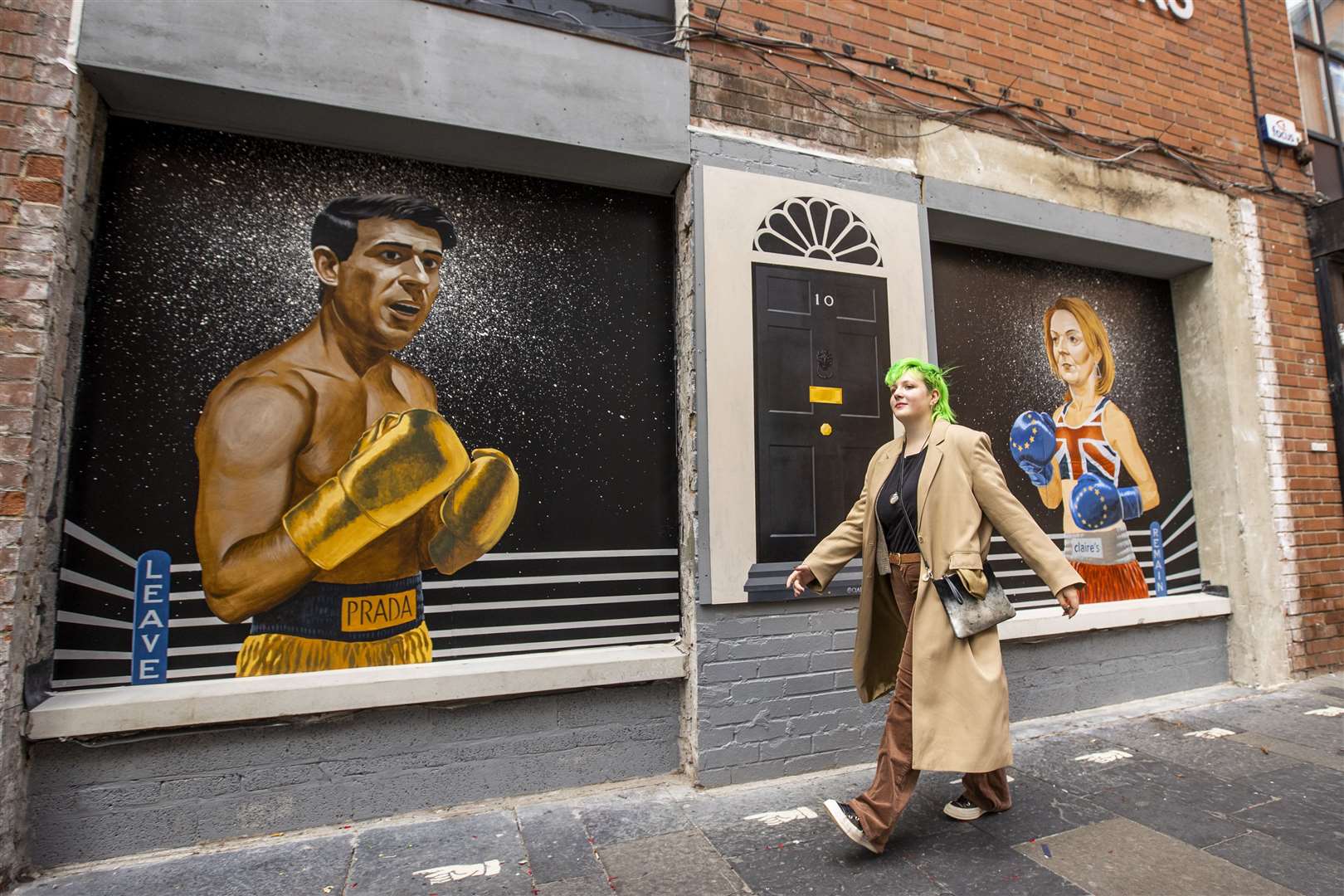 A mural on Hill Street in Belfast by Ciaran Gallagher Art, commissioned by local bar owner Willie Jack, showing Conservative Party leadership candidates Rishi Sunak and Liz Truss as two boxers about to fight it out to be the UK prime minister (Liam McBurney/PA)