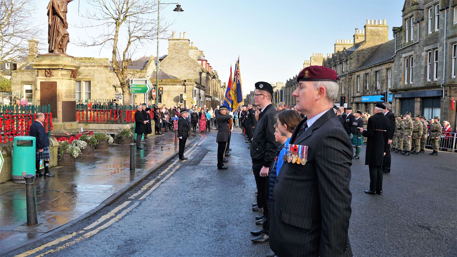 Remembrance Sunday parade members line up in front of the town's war memorial in Thurso. Picture: DGS