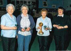 Delighted Caithness bowlers show off their awards after winning the annual competition against Orkney. The players are (from left): Sheila Main, Eva Swanson, Hazel Harrold and Olwyn Campbell. Photo: John Macrae