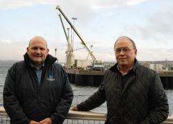 Scrabster Harbour Trust manager Sandy Mackie (left) and chairman William Calder claim the port is in pole position to service new marine energy and gas traffic. Photo: Alan Shields