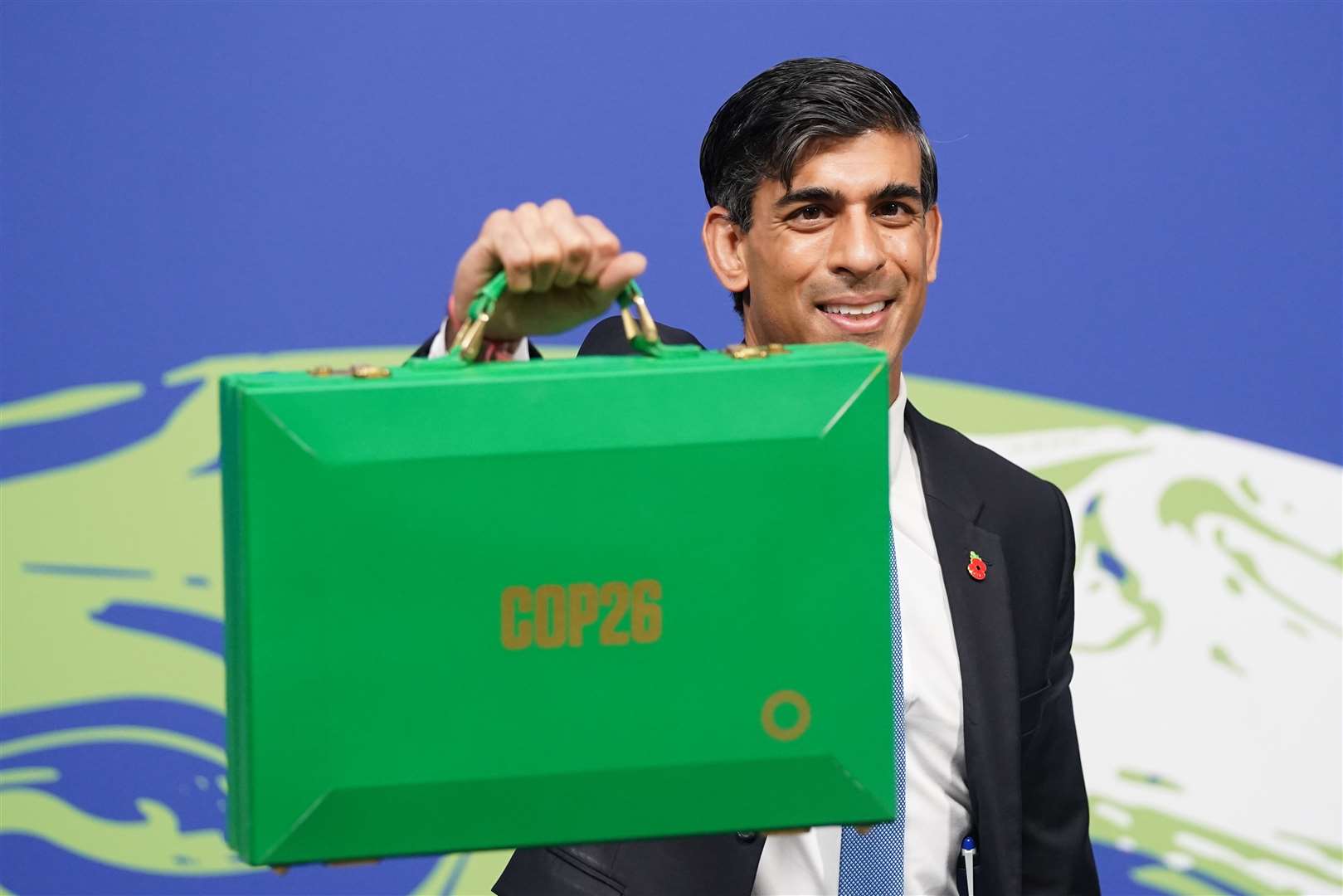 Then chancellor Rishi Sunak holds his Green Box at the Cop26 summit (Stefan Rousseau/PA)