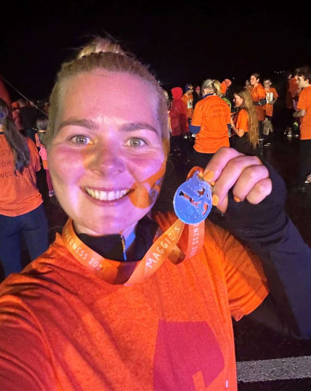 Jacqueline Coghill with her medal after completing Run the Runway 2023 at Inverness Airport in aid of Maggie’s Highlands.