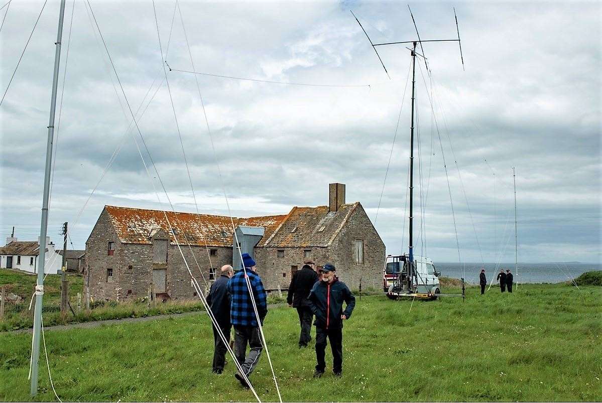 Amateur radio enthusiasts gather in front of the John O'Groats Mill.