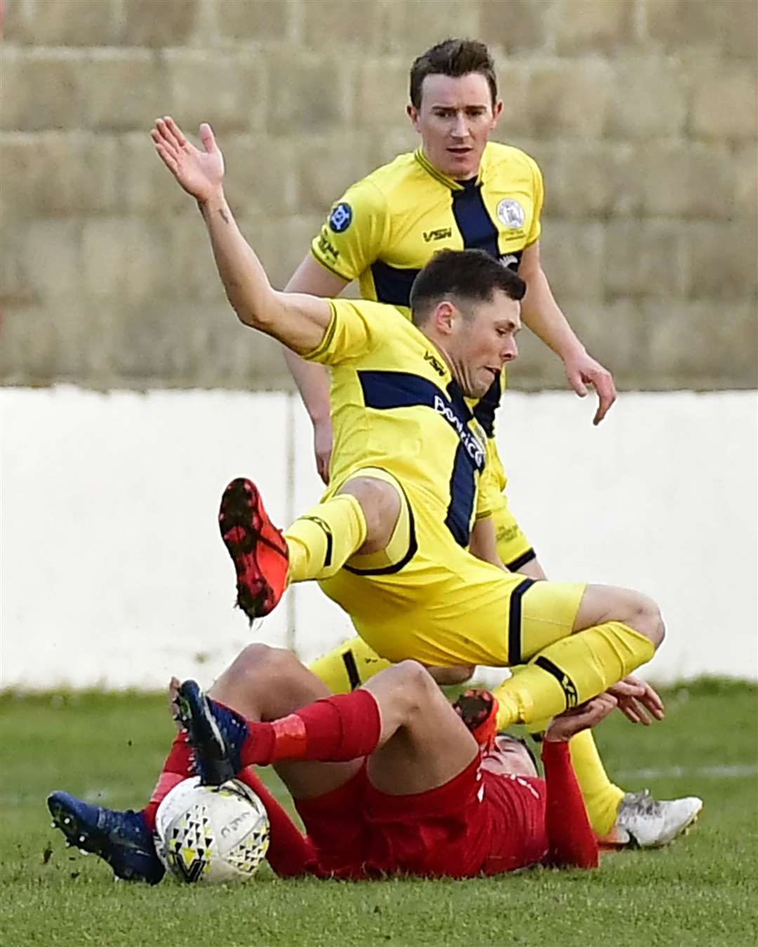 Wick Academy's Jack Henry takes a tumble during the Scorries' 2-0 win at Lossiemouth last week. Tom McKenna's side host Nairn County on Saturday and hope to give the fans more to cheer about. Picture: Mel Roger