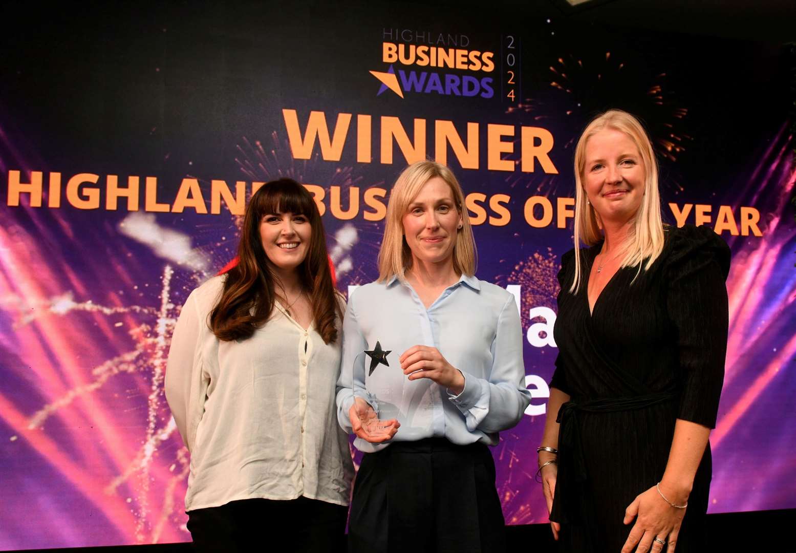 Kathryn Scollie (left) and Helen Inkster of Pentland Ferries pick up the Highland Business of the Year award from Kirsten Sadler of sponsor Balfour Beatty. Picture: James Mackenzie