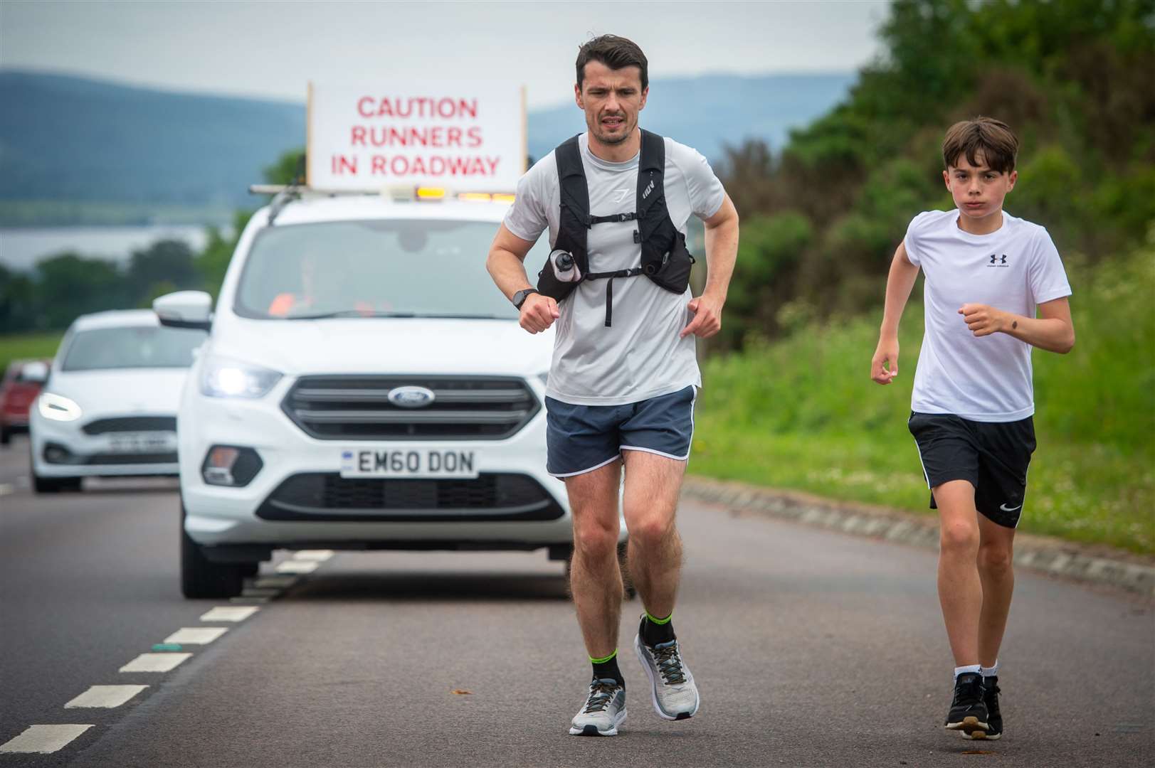 Steven Mackay with his son Dylan, who joined him on the last of the four marathons. Picture: Callum Mackay