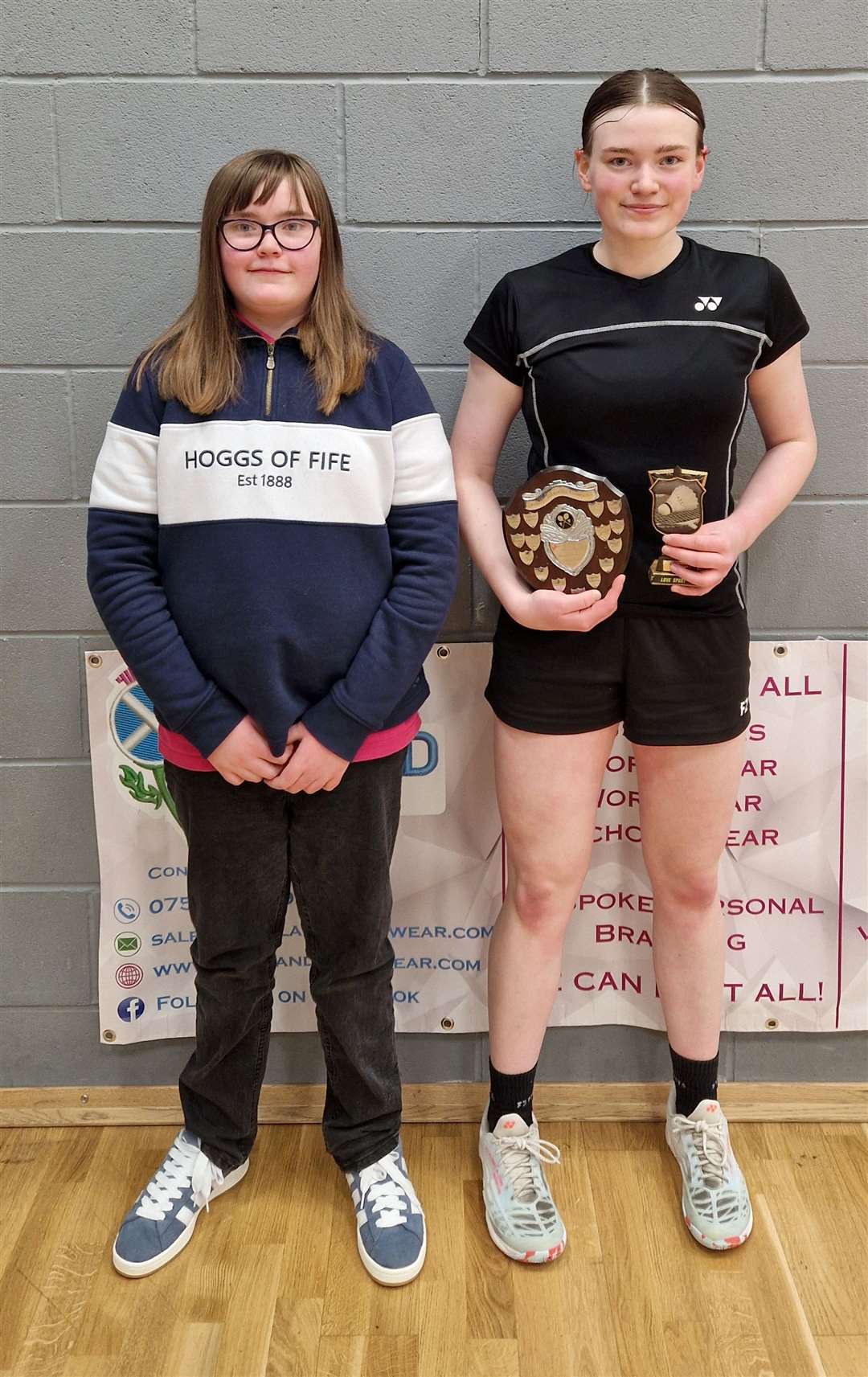 Girls' singles winner Chloe Mackenzie (right) with her sister Lexie, who was representing event sponsor Highland Workwear.