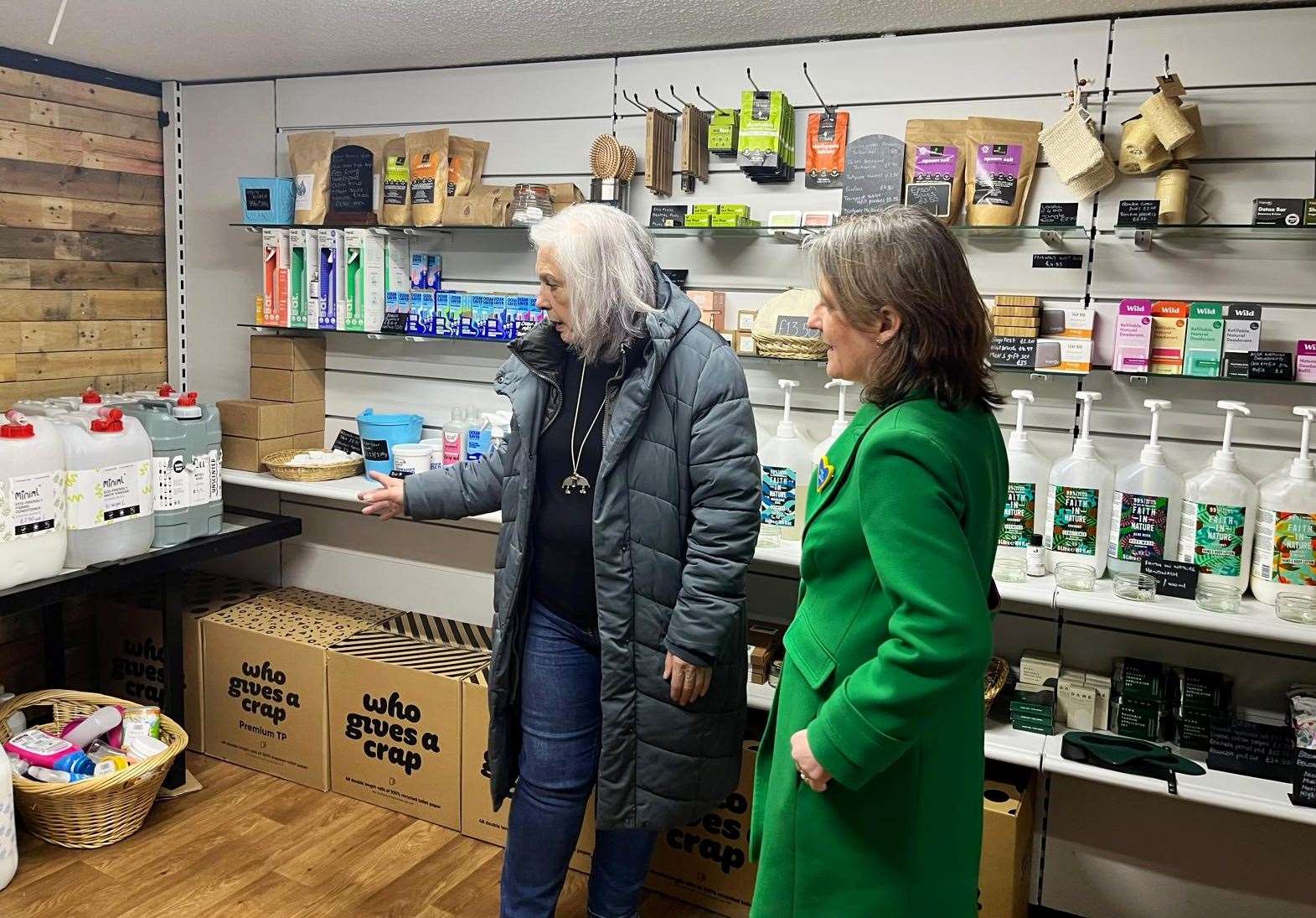 TCDT chairperson Helen Allan (left) showing Maree Todd MSP the Socially Growing refill shop in May last year.