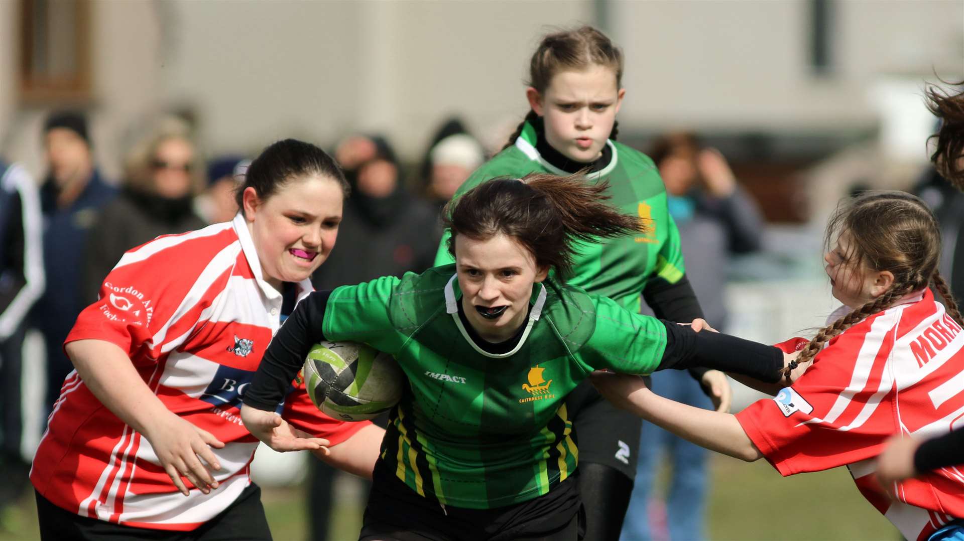 Chloe Miller fends off two defenders en route to scoring one of her three tries in Caithness Girls U15s' National Cup semi-final victory against Grampian.Picture: James Gunn