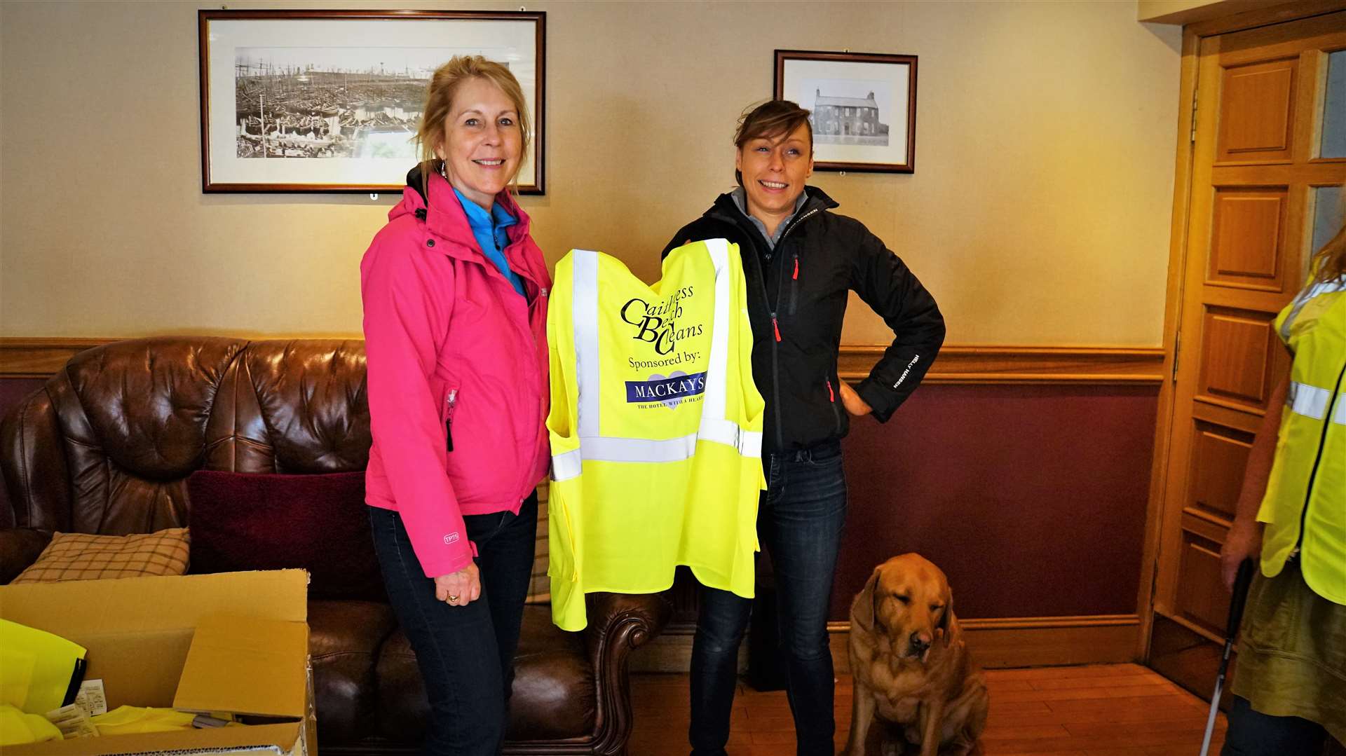 Showing off the new high vis waistcoats are Ellie Lamont (left) with her daughter Jennifer and Max the dog.