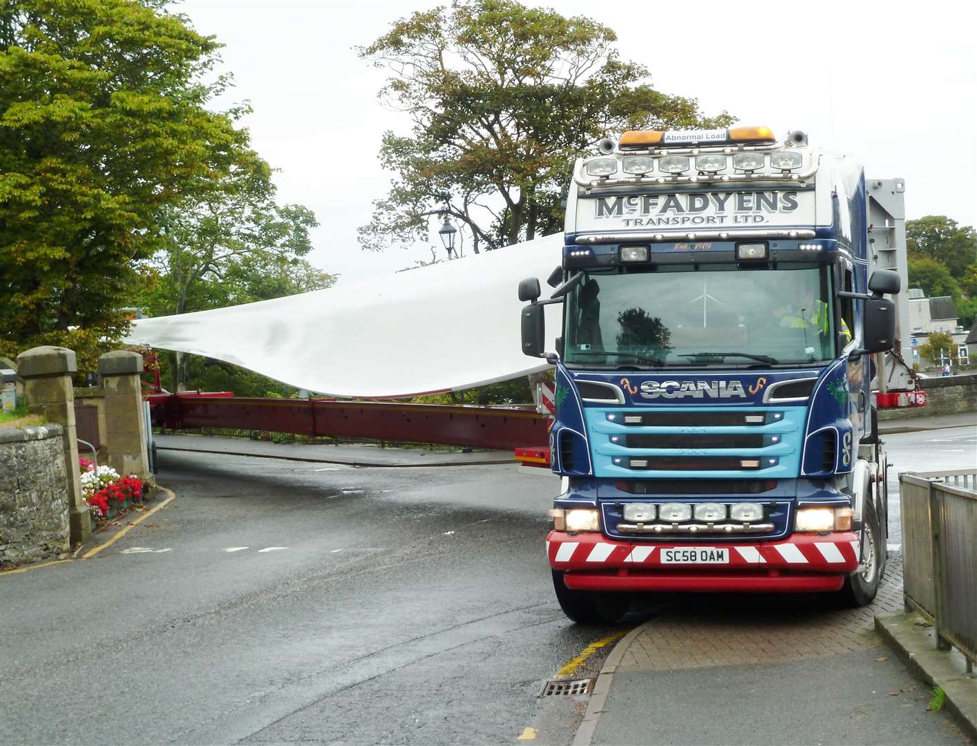 Negotiating tight bends in Wick can be a major issue for the effective transportation of the wind turbine parts. This shows a lorry turning from Station Road and heading to the Halsary wind farm site during its construction. Picture: Peter Sutherland