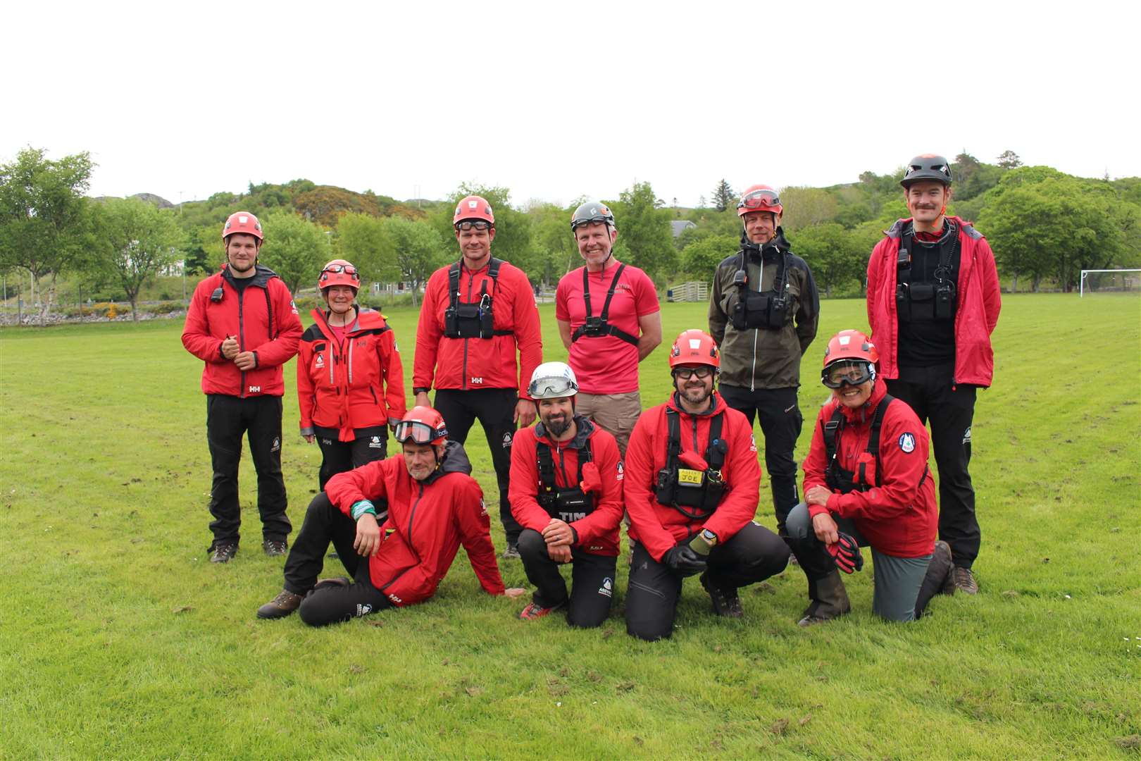 Members of the Assynt Mountain Rescue Team pose for a photo while waiting for the helicopter. Picture: John Davidson