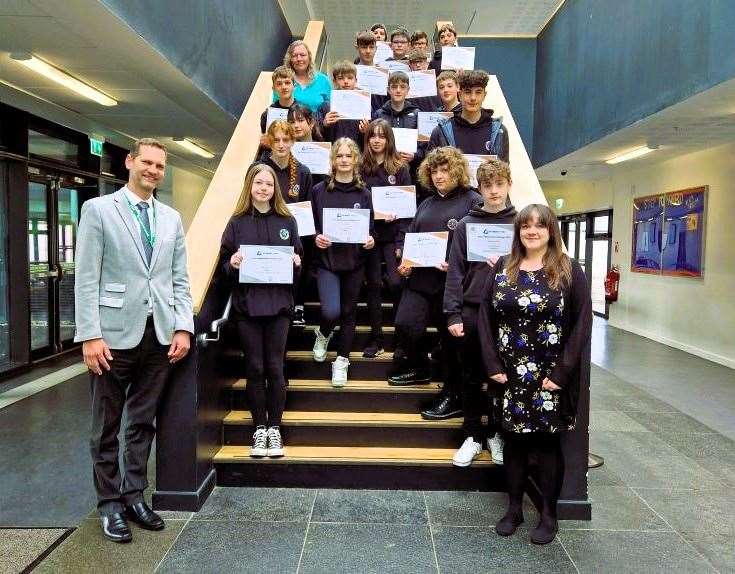 Wick High School pupils with their certificates along with rector Sebastian Sandecki and teacher Kirsty Orr. Picture: WHS