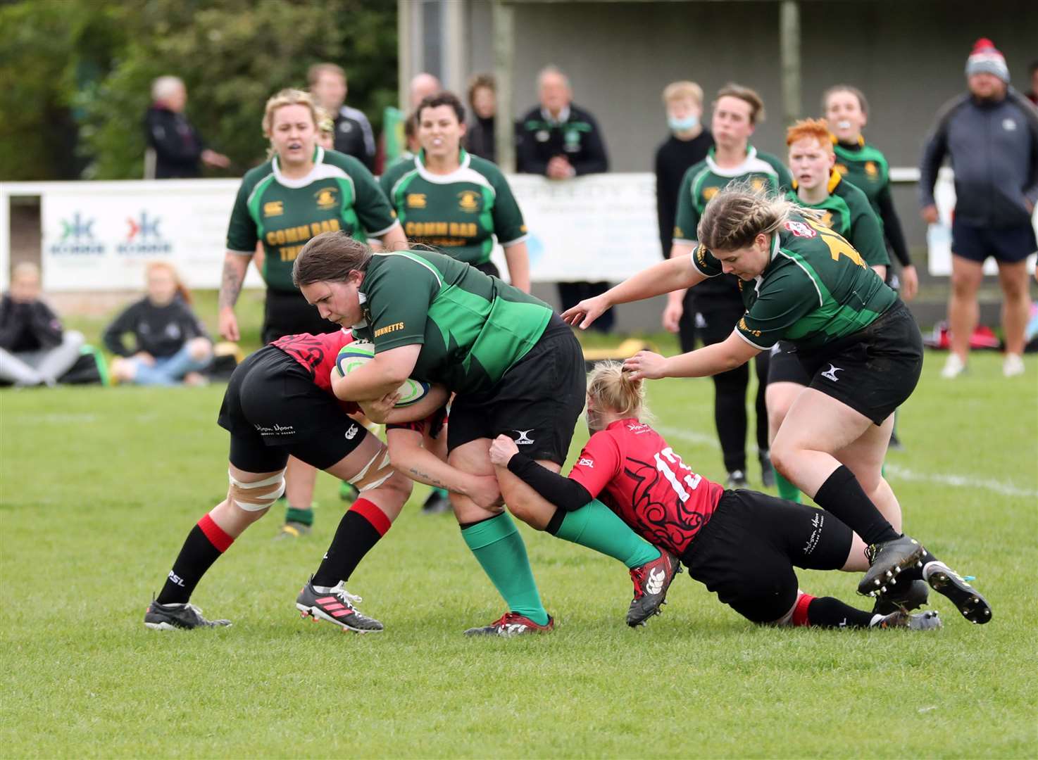 Anja Johnston powers her way through the Orkney defence with back-up from Justine Mackay. Picture: James Gunn
