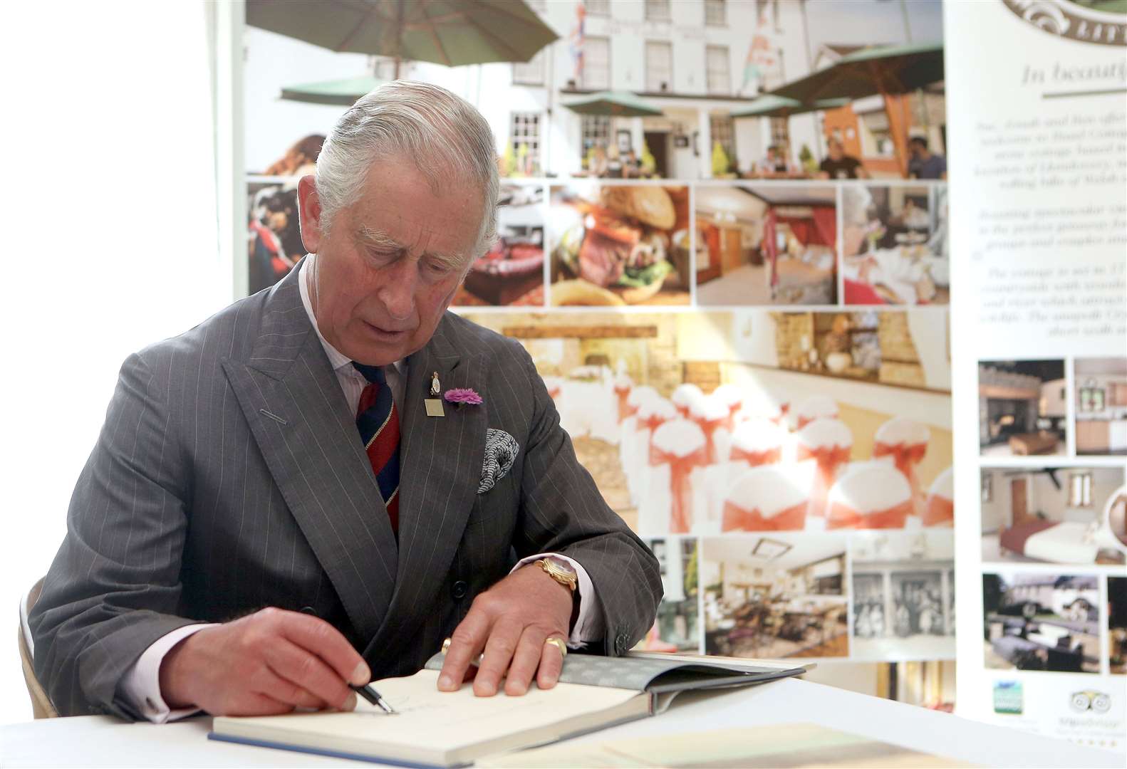 The then-Prince of Wales signed a book of his watercolours which were to be auctioned for charity (Steve Parsons/PA)